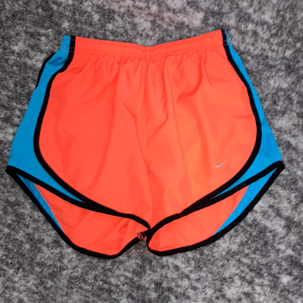 Nike athletic shorts, color orange and blue, woman’s size small